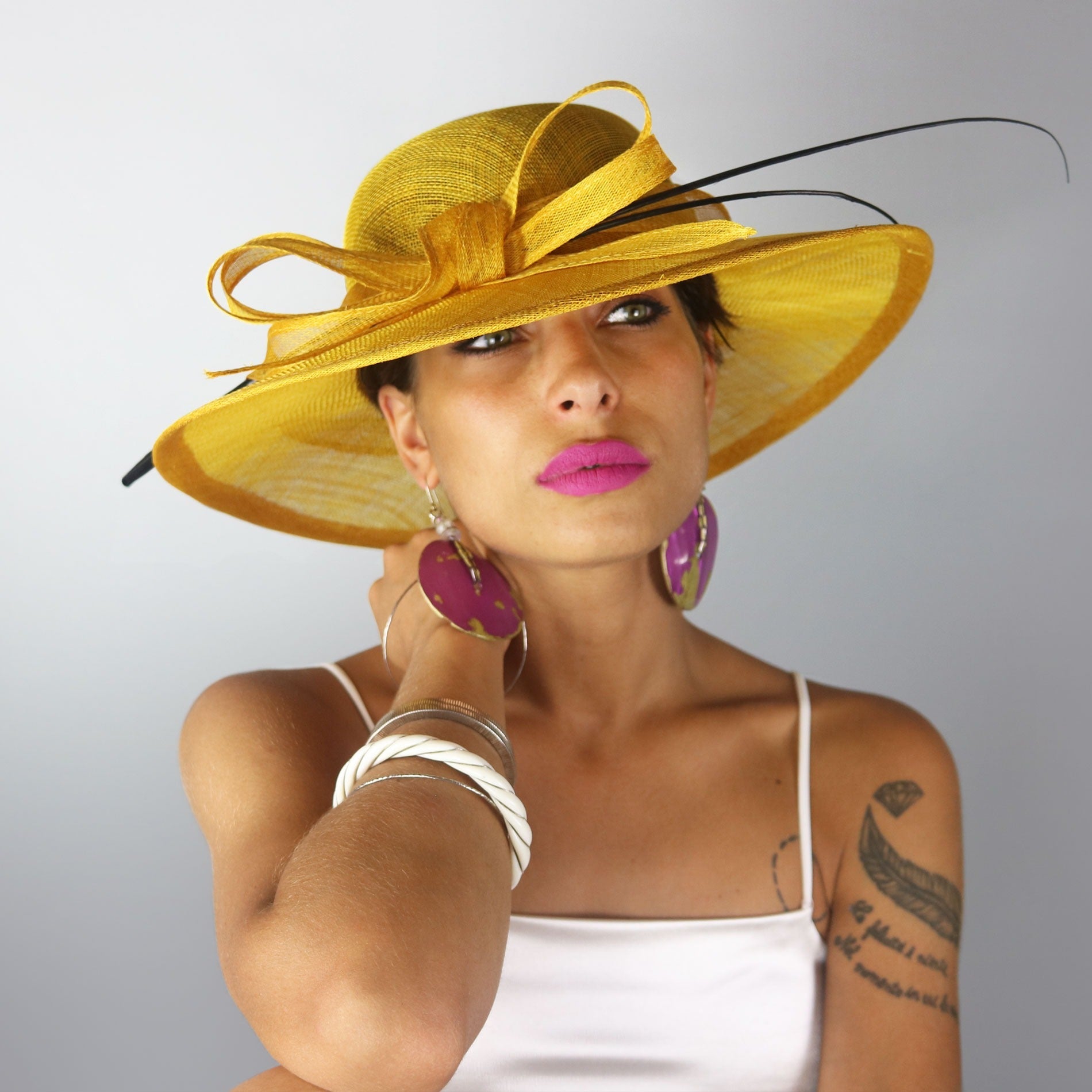 Woman in yellow dress hat