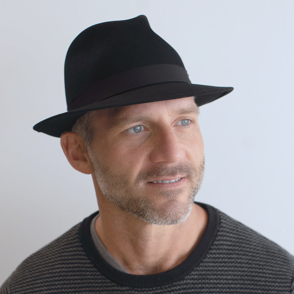 man wearing black fedora belfry frankie c with snapped brim