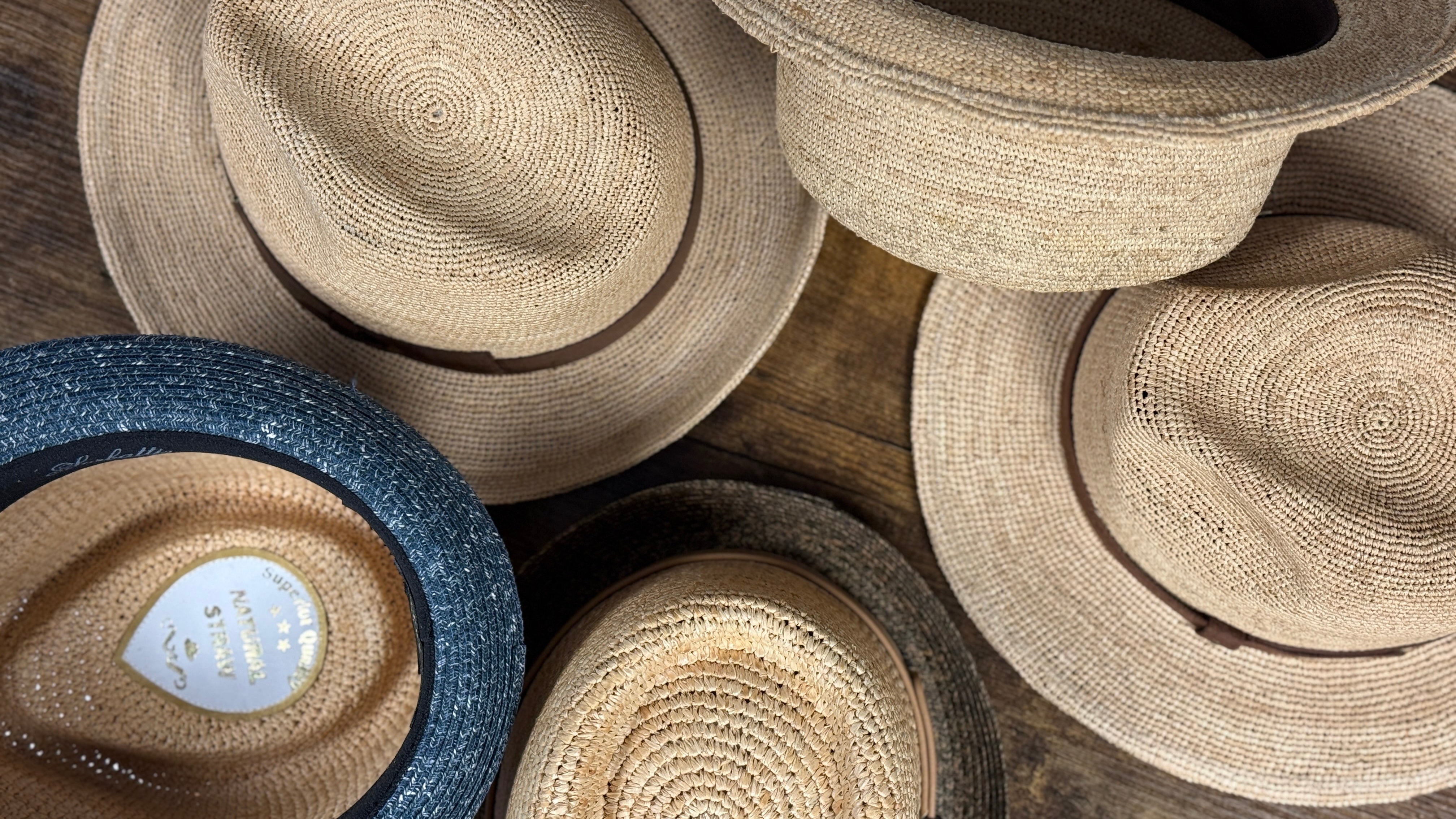 collection of raffia straw hats