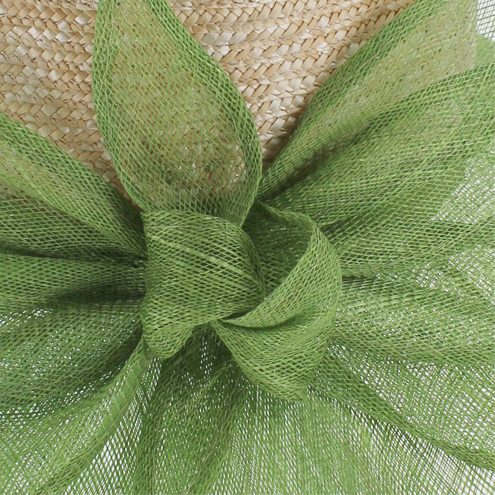 Green lampshade hat with braided straw crown and floral accent for versatile styling