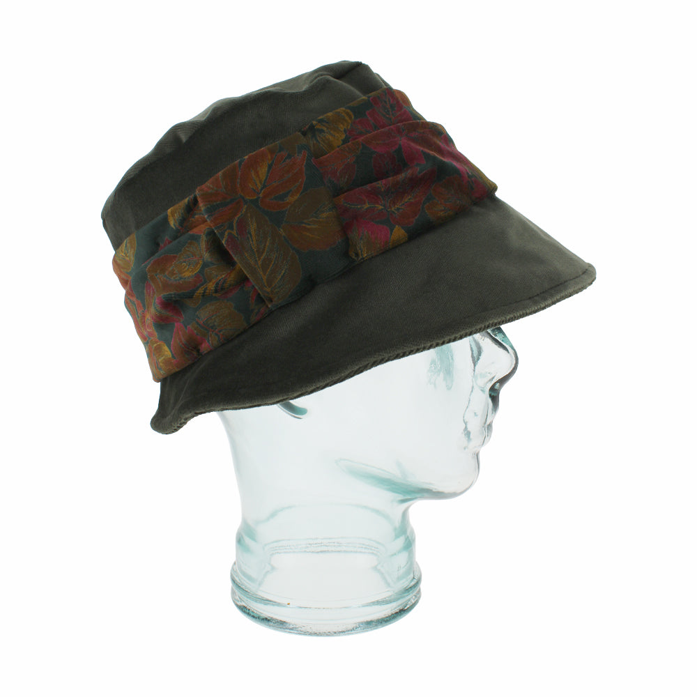 Side view of Belfry Aronne olive cotton hat showing soft shape and velvet trim