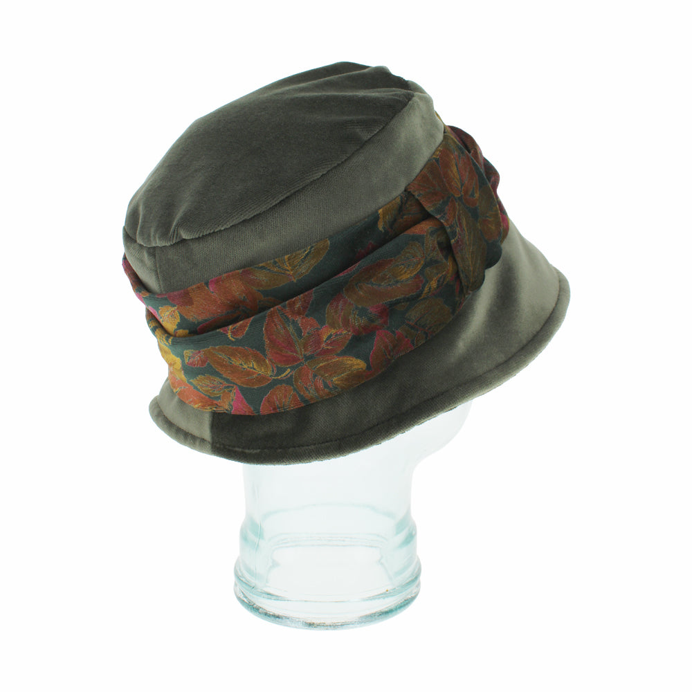 Angled shot of Aronne olive bucket hat with elegant floral velvet band accent