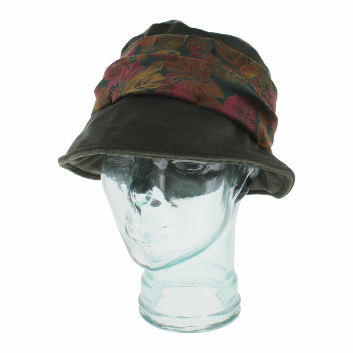 Close-up of Belfry Aronne olive hat showing vibrant velvet floral band and soft finish