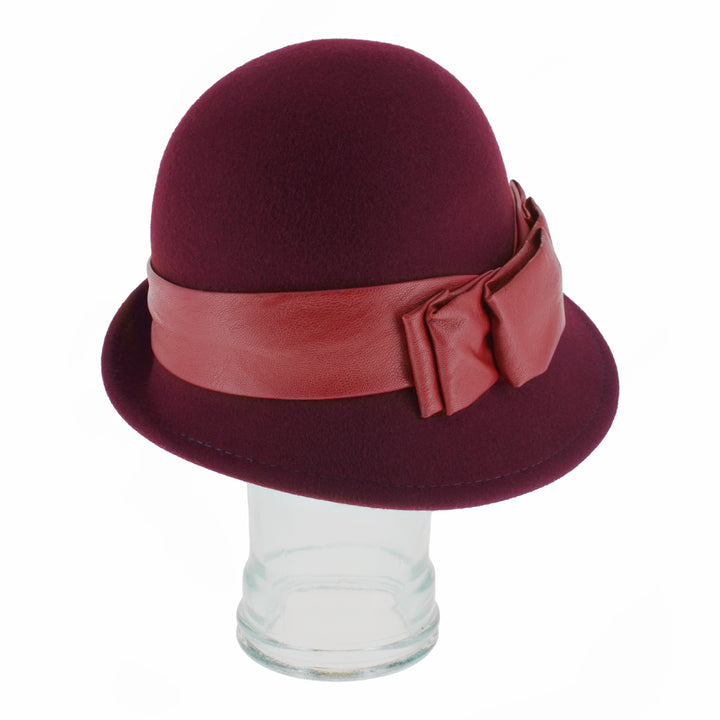 Angled shot of Belfry Carabelle wine wool cloche with soft 1920s-inspired silhouette