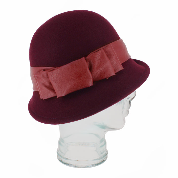 Side view of Carabelle wine cloche highlighting curved brim and faux leather trim