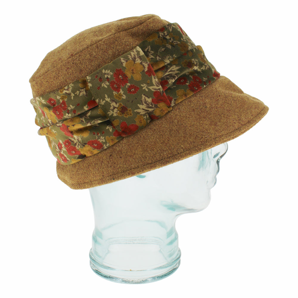 Side view of Belfry Cassio gold wool hat showing velvet band and cloche-style shape