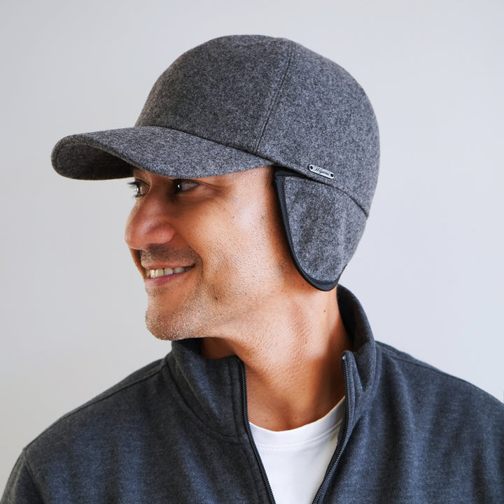 Side view of Grey Wigens Cedric 100% wool baseball cap showing extended bill and ear flaps for cold-season comfort
