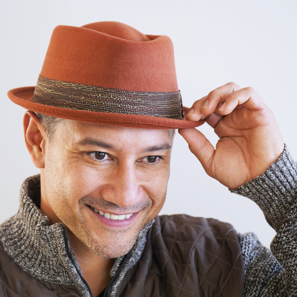Orange Hermes wool pork pie hat with diamond crown and woven band, handcrafted in Italy by Belfry Italia