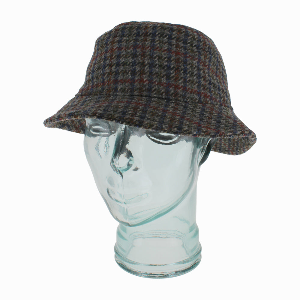 Side view of Houndstooth Crostini wool bucket hat showing classic pattern and lined interior for winter comfort