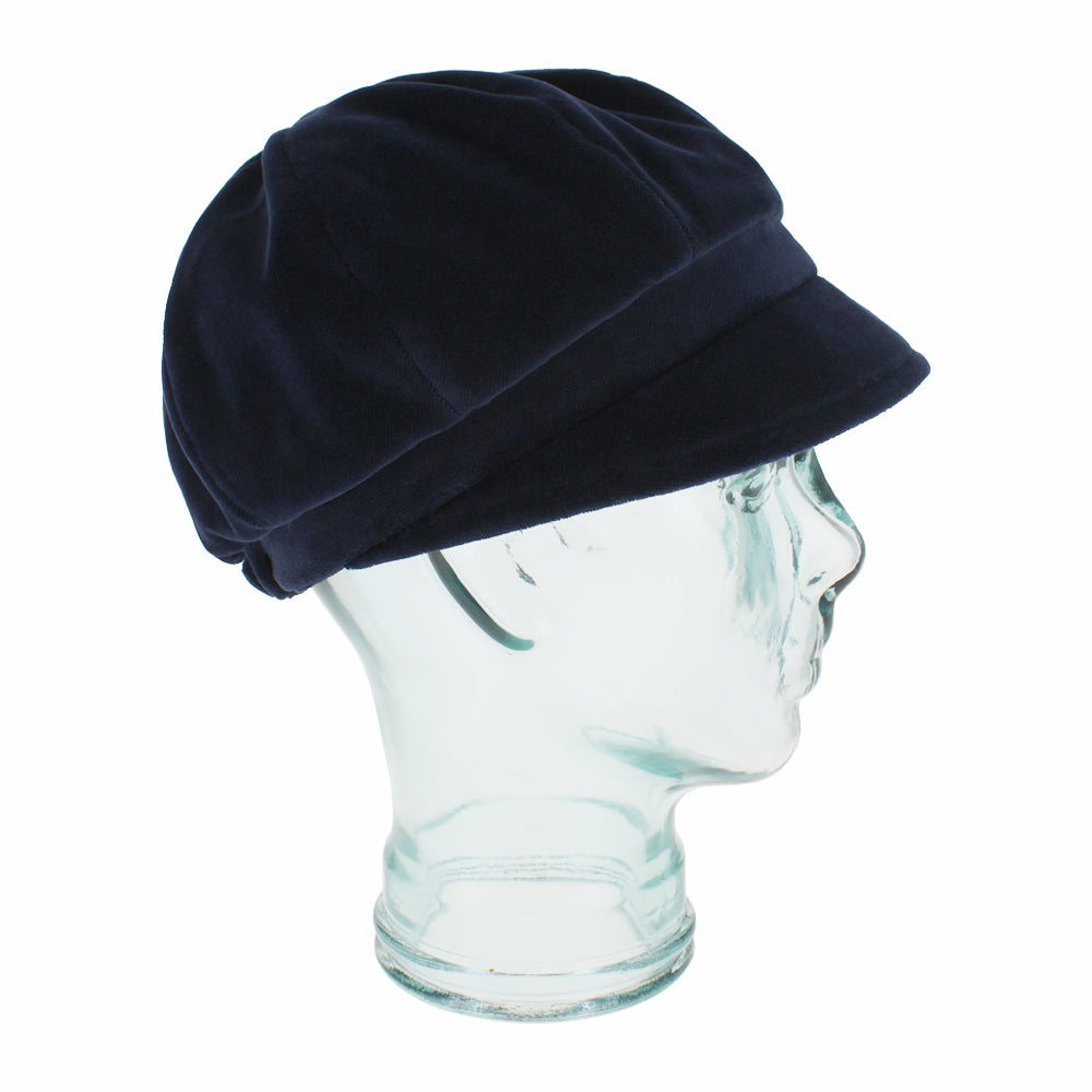 Side view of Belfry Dania navy 8-panel cap showing smooth velvet texture and shape