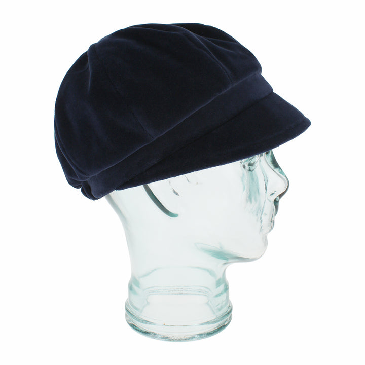 Side view of Belfry Dania navy 8-panel cap showing smooth velvet texture and shape