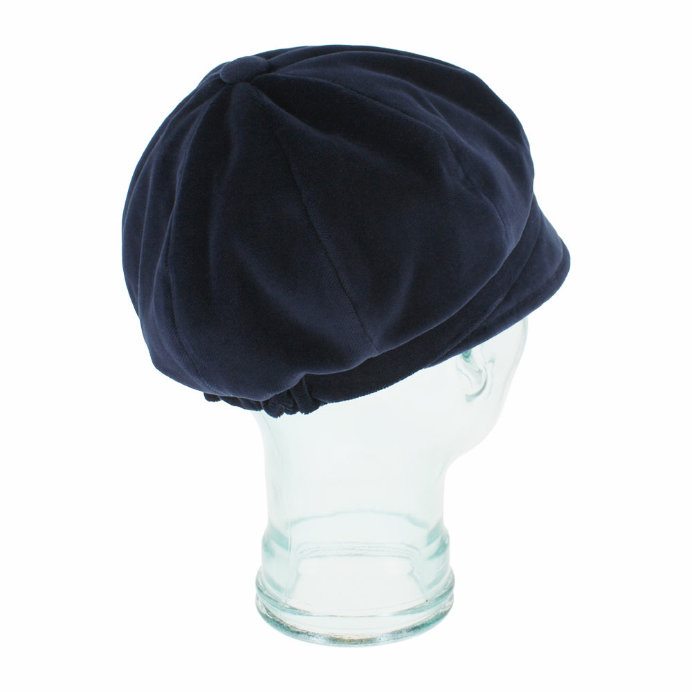 Angled shot of Dania navy velvet mod cap highlighting elegant structure and finish
