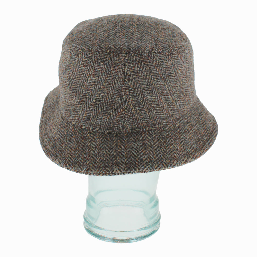 Detail shot of Herringbone Belfry Desi wool bucket hat showing textured pattern and lined interior