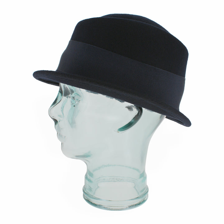 Angled view of the Belfry Donetta stingy brim hat in blue wool with 2" brim, 4" crown, and grosgrain band, a chic women’s seasonal piece for autumn and winter fashion