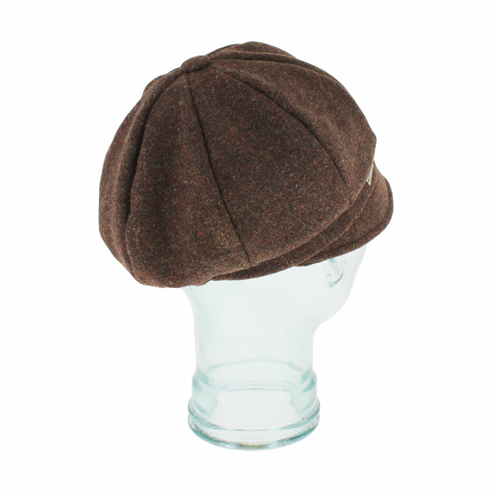 Angled shot of Edda brown mod cap featuring button top and clean 8-panel design