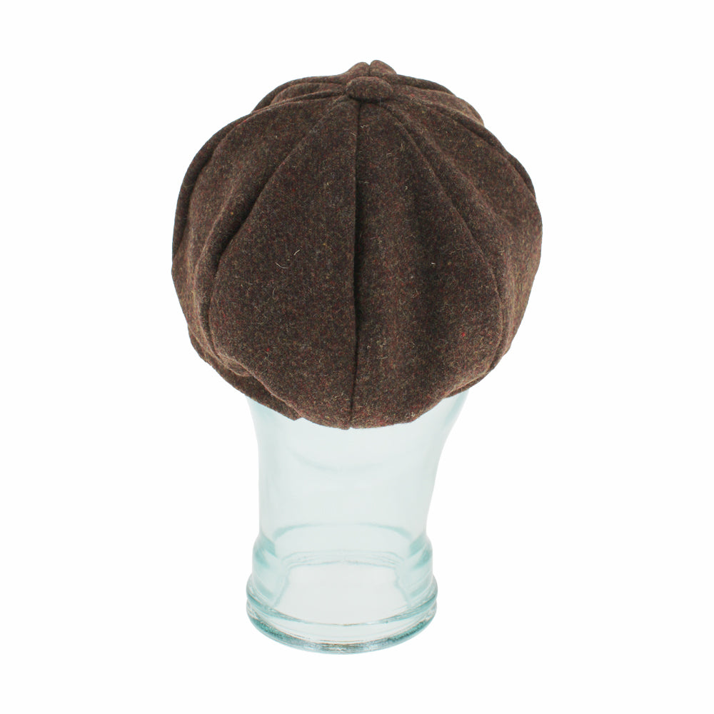 Top view of Belfry Edda brown cap highlighting its signature button detail