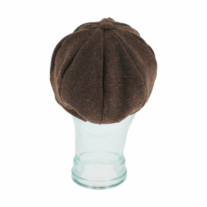 Top view of Belfry Edda brown cap highlighting its signature button detail