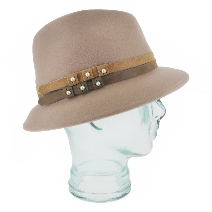 Close-up of the Belfry Elda nude trilby crafted from 100% wool, showcasing asymmetrical brim, pearl-accented leather bands, and refined detailing for autumn and winter wear