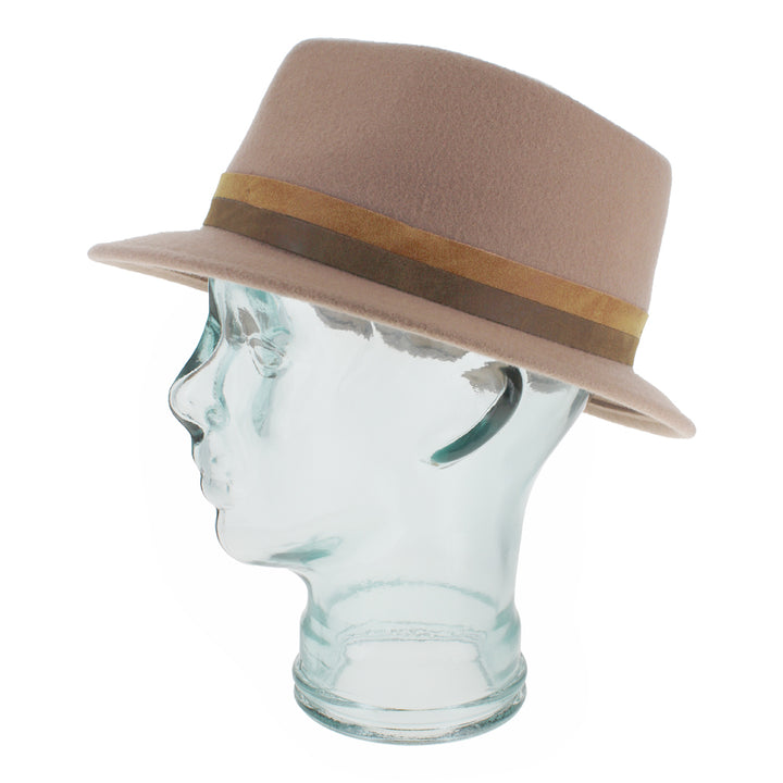 Angled shot of the Belfry Elda trilby in nude wool featuring refined asymmetrical styling and delicate pearl details, a chic seasonal accessory for fall and winter wardrobes