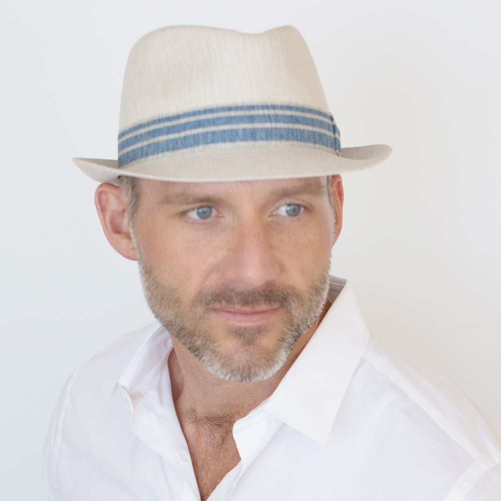 Natural linen trilby hat with teardrop crown and blue striped band by Belfry Italia
