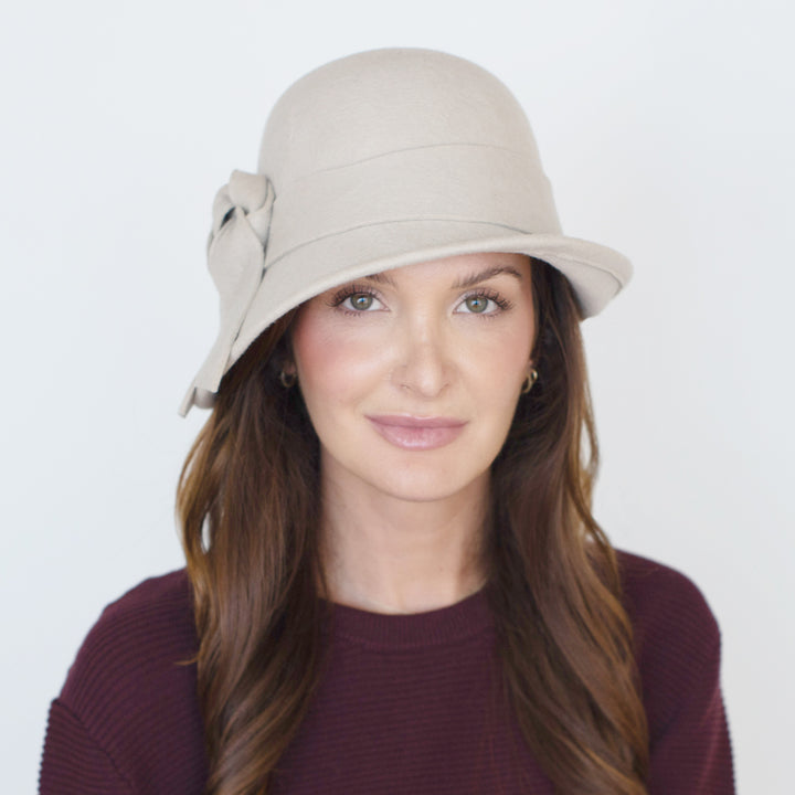 Belfry Fleur alabaster wool cloche with asymmetrical brim and hand-knotted bow