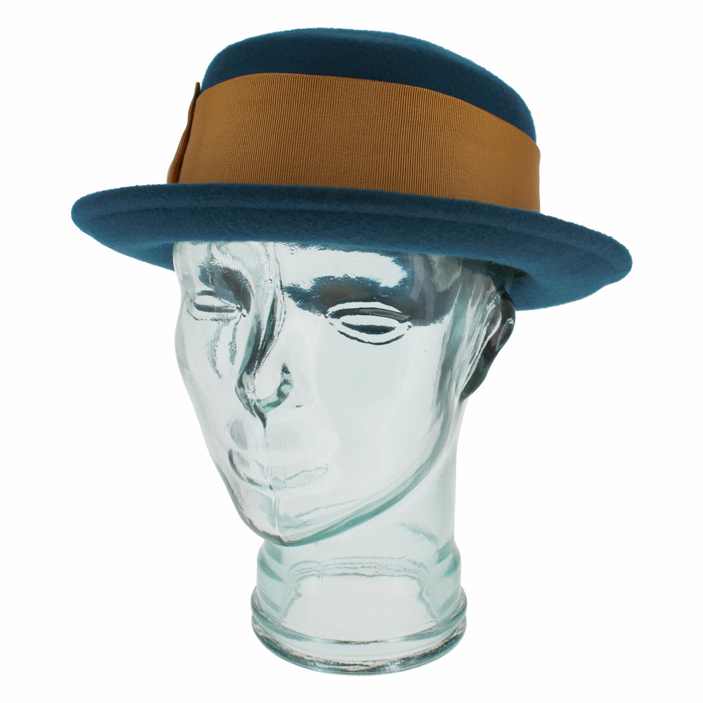 Top view of the Belfry Gardiner boater hat in teal blue wool with gold bow and grosgrain band, an elegant cold-weather accessory for chic autumn and winter women’s fashion