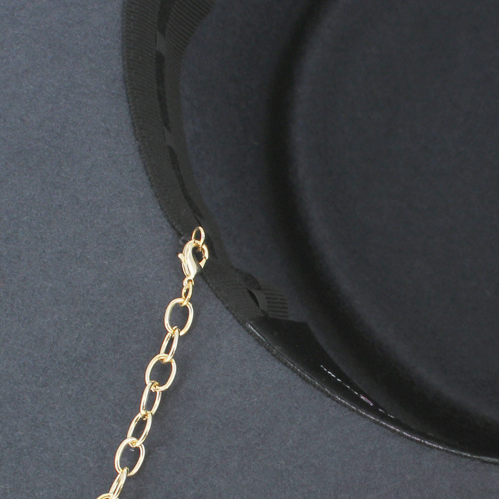 Belfry Gessica grey bolero combining minimal structure with stylish gold chain flair