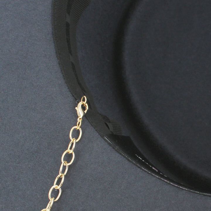 Belfry Gessica grey bolero combining minimal structure with stylish gold chain flair