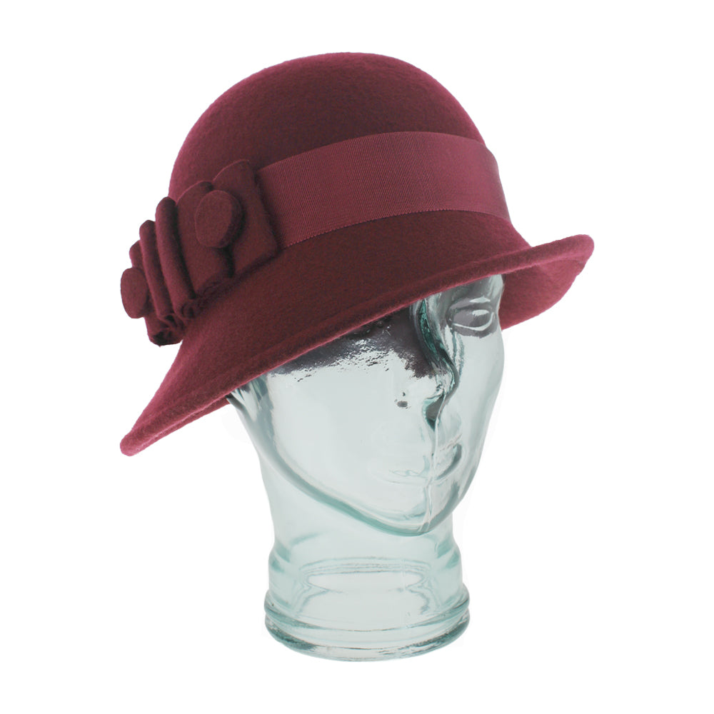 Belfry Ginny cloche hat in deep wine wool, detailed with grosgrain ribbon band, felt bow, and hat pin, perfect for fall and winter sophisticated style