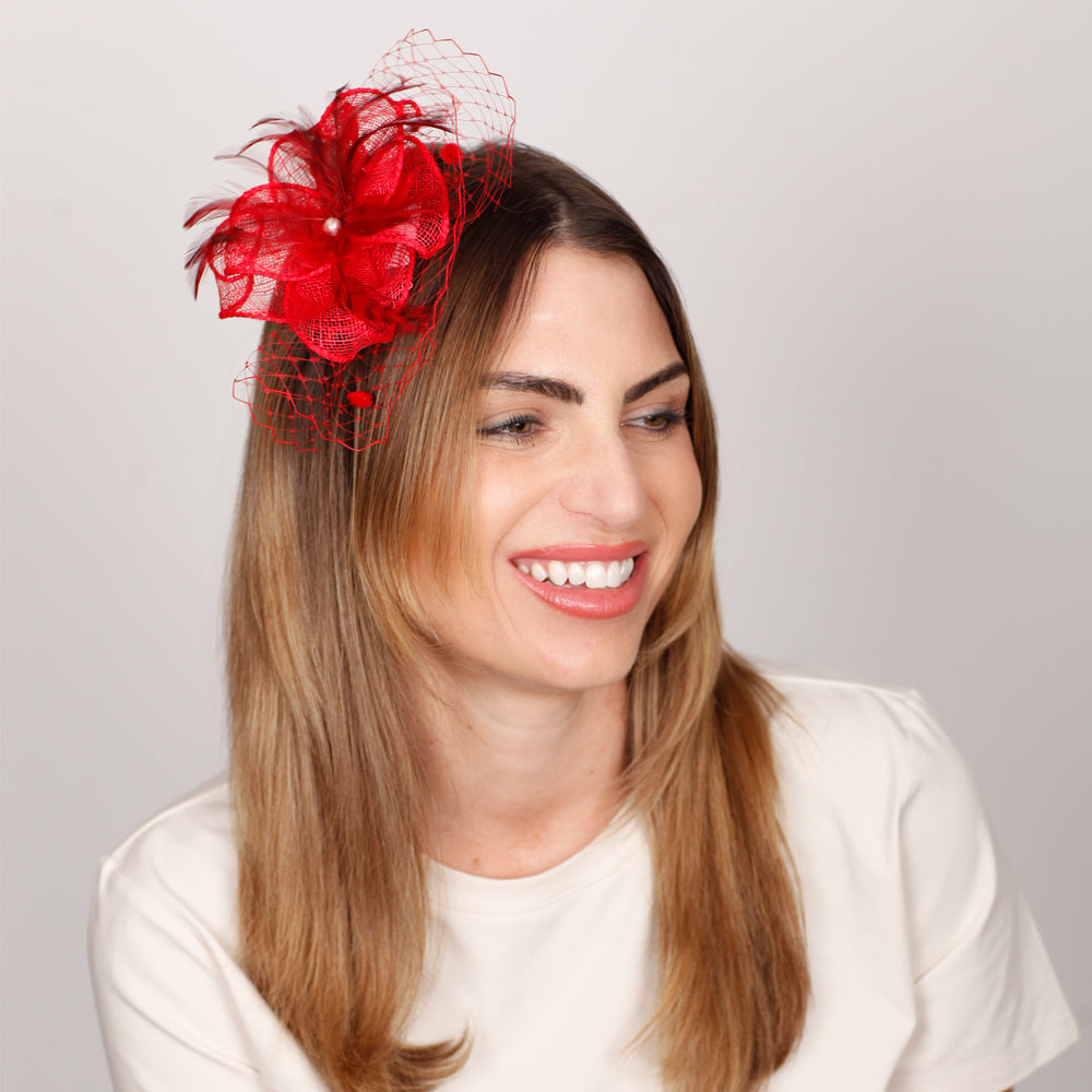 Red sinamay hair clip fascinator with beehive netting, elegant handcrafted Italian accessory
