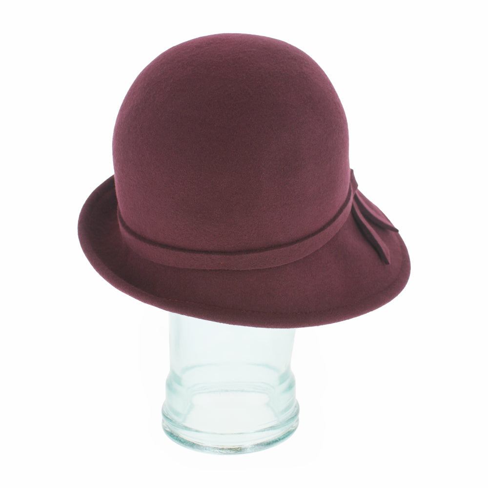 Detailed shot of the Belfry Harriet burgundy wool cloche hat highlighting its classic structure and versatile design, ideal for seasonal autumn and winter fashion outfits