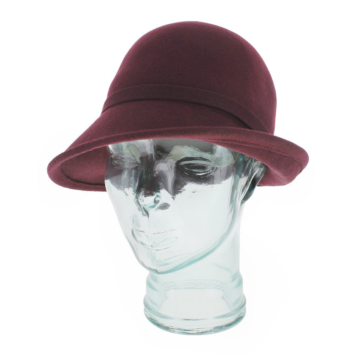 Top view of the Belfry Harriet burgundy cloche hat with rounded crown and asymmetrical brim, a versatile fall and winter accessory for women’s seasonal fashion