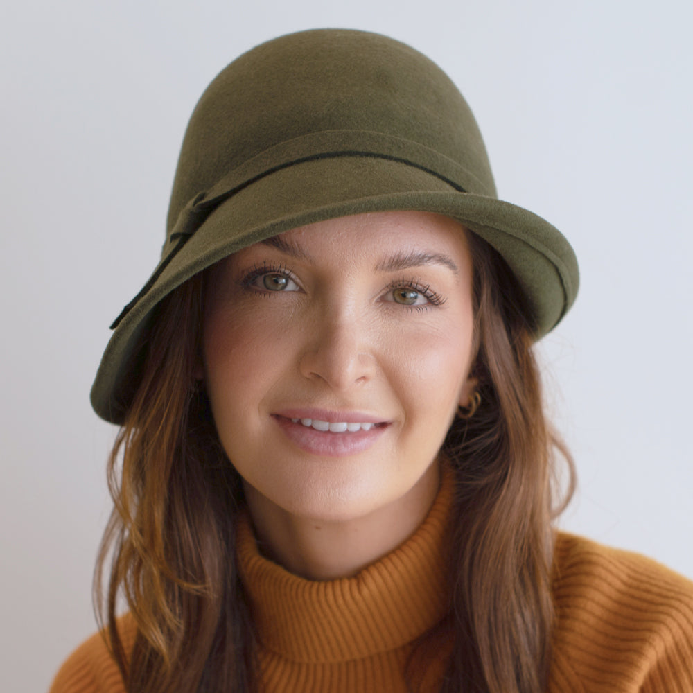 woman wearing olive green cloche with same material band belfry harriett