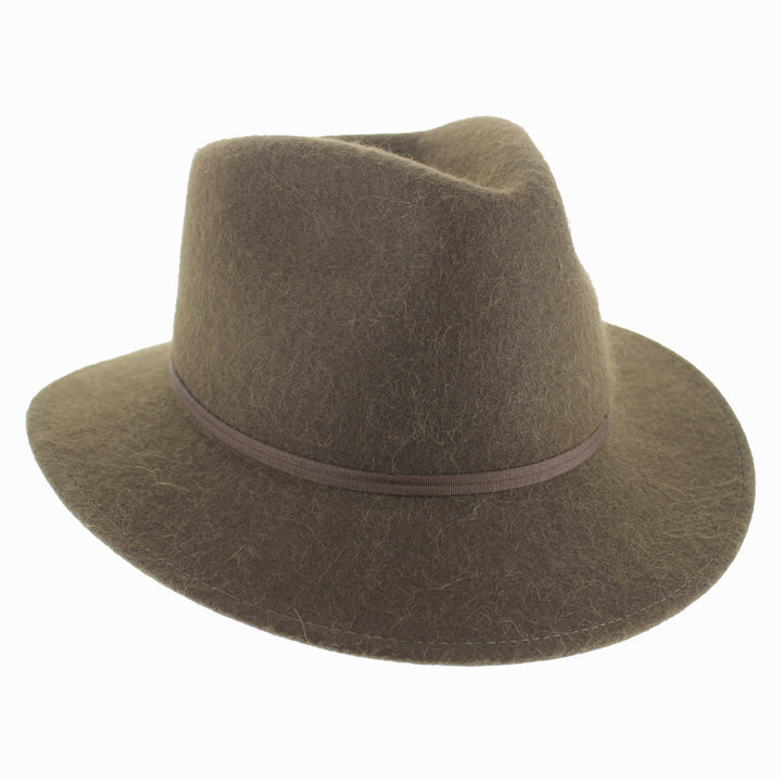 Model wearing Olive Belfry Sebastian alpaca wool safari hat with wide brim for stylish fall winter travel