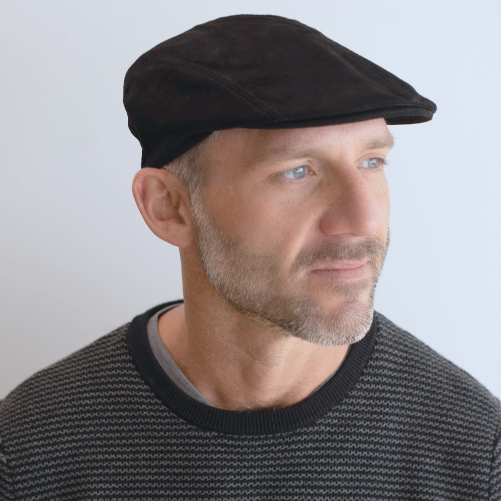 man wearing black suede four panel cap belfry ignazio