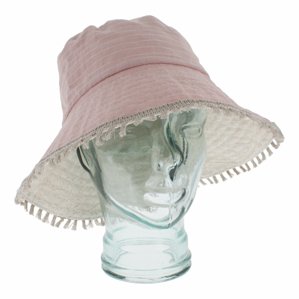 Light pink bucket hat with reversible design and lightweight breathable everyday comfort