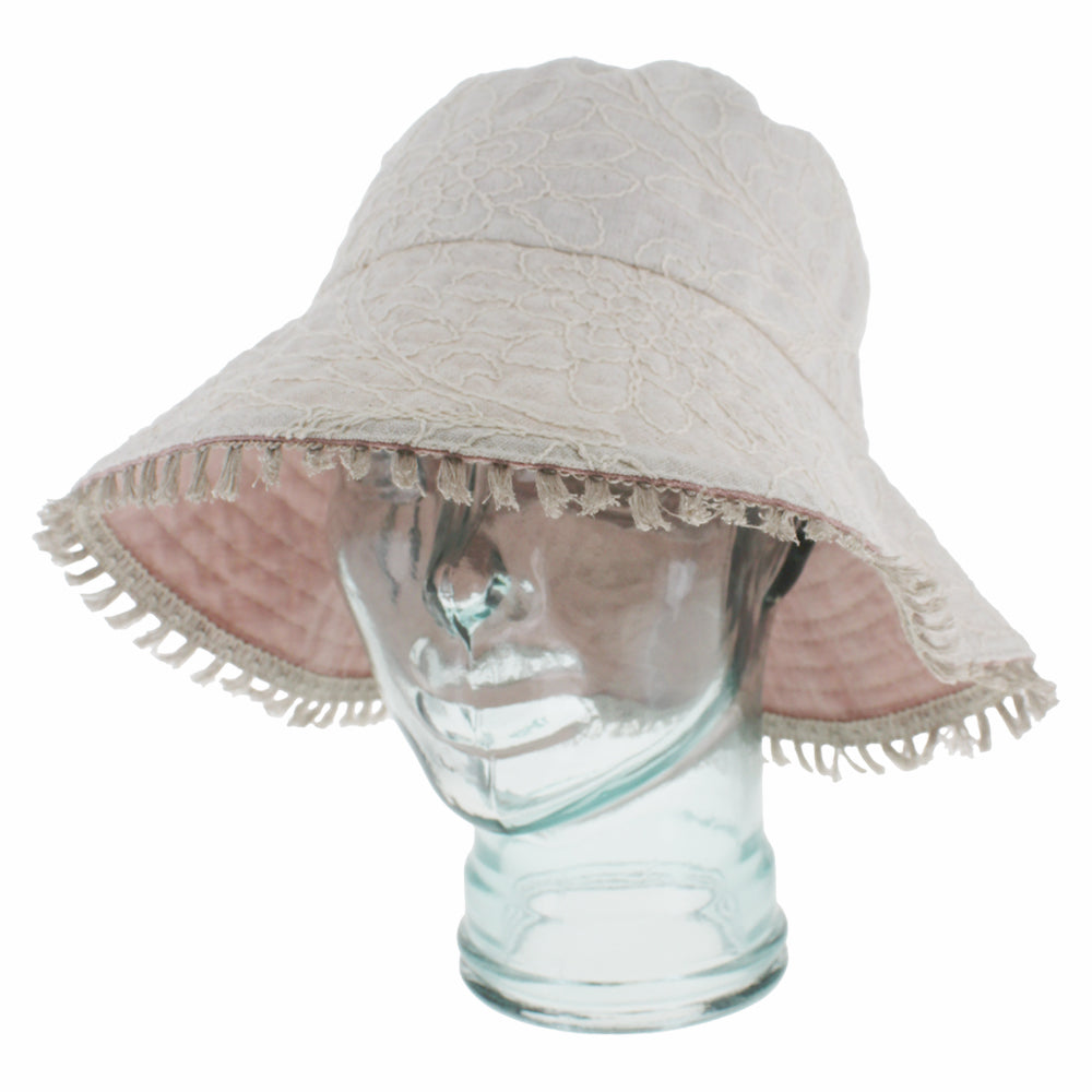Light pink bucket hat with versatile styling and lightweight summer comfort