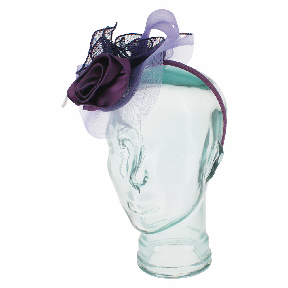 Belfry Italia purple fascinator with floral and feather accents for formal wear