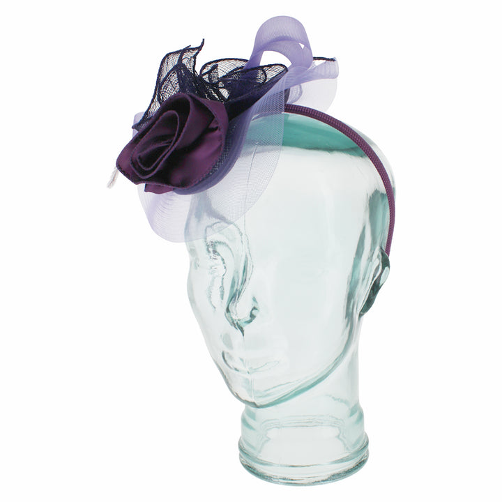 Belfry Italia purple fascinator with floral and feather accents for formal wear