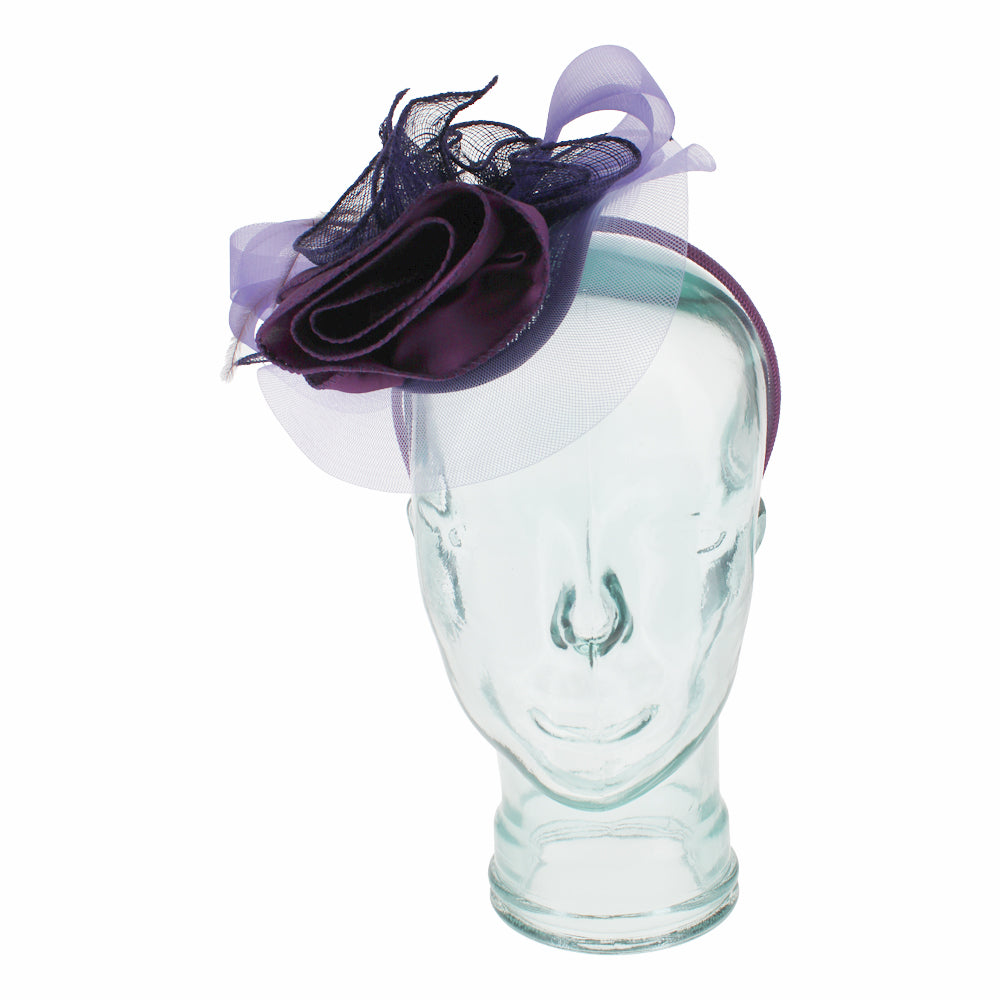 Purple headband fascinator with satin flower designed for races weddings and events