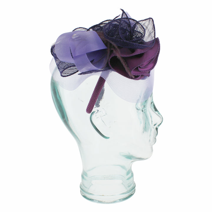 Belfry Livia purple fascinator with sinamay base satin flower and soft feather accents