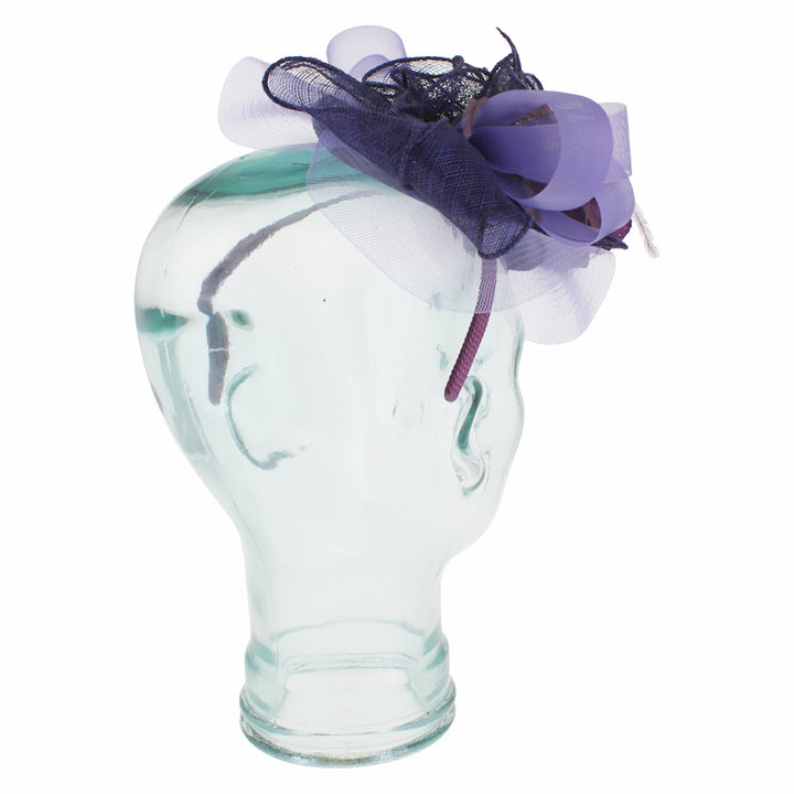 Purple fascinator with satin flower and feathers on headband for weddings and events
