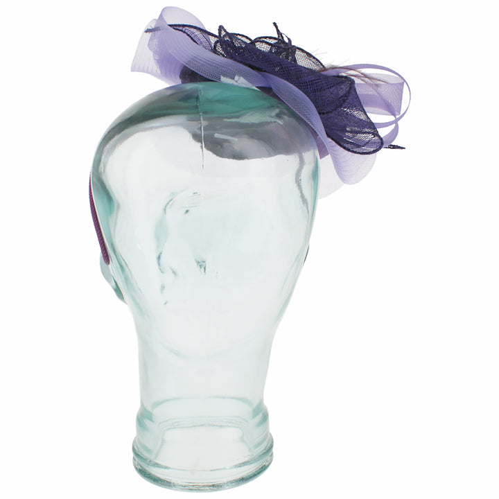 Elegant purple headband fascinator with floral detail and feather accents for occasions