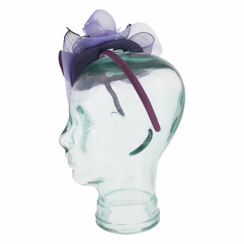 Purple sinamay fascinator with satin flower and feather design for refined styling