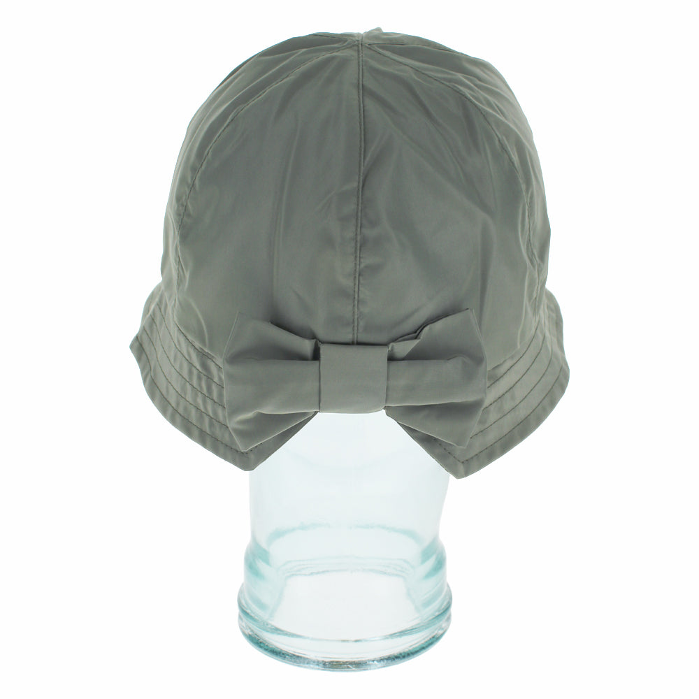 An olive green bucket hat with a large matching fabric bow on the back