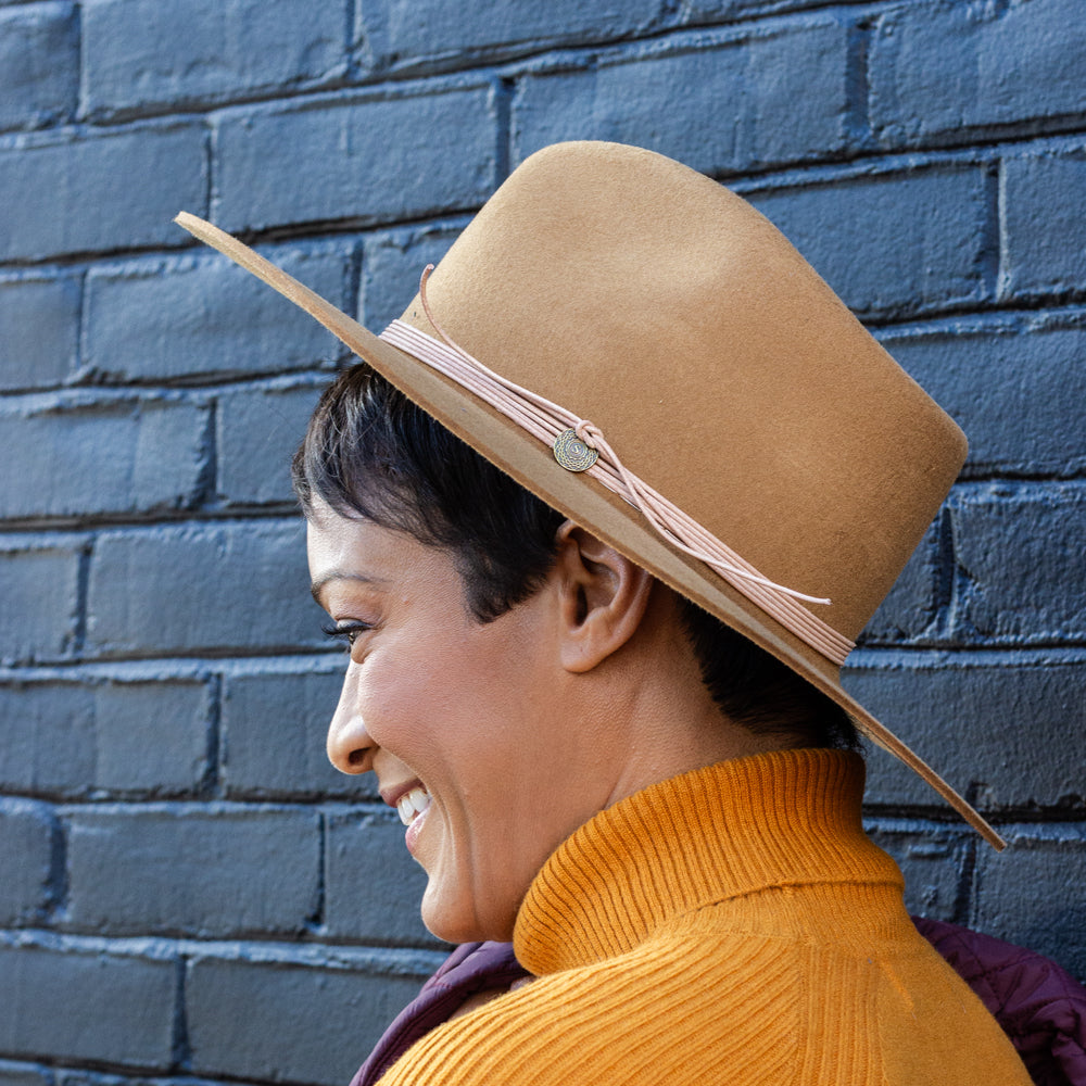 Fall-ready wide brim fedora in toffee brown, featuring Western-style leather band and teardrop crown