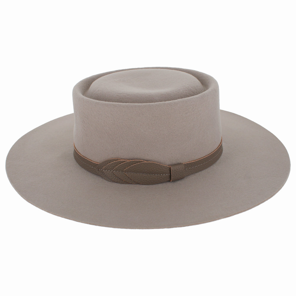 Top view of Belfry Mirta nude hat highlighting its crisp crown and bolero shape