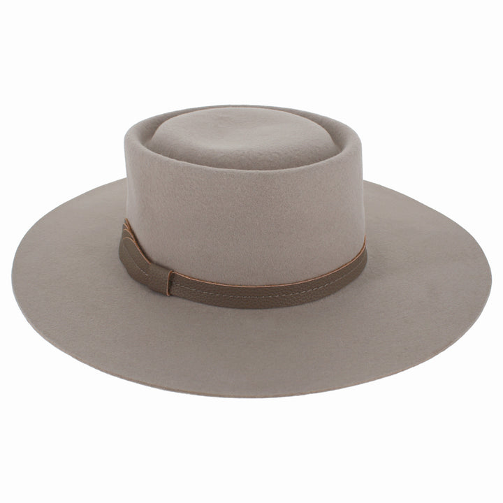 Angled shot of Mirta nude boater hat showing clean lines and wide brim