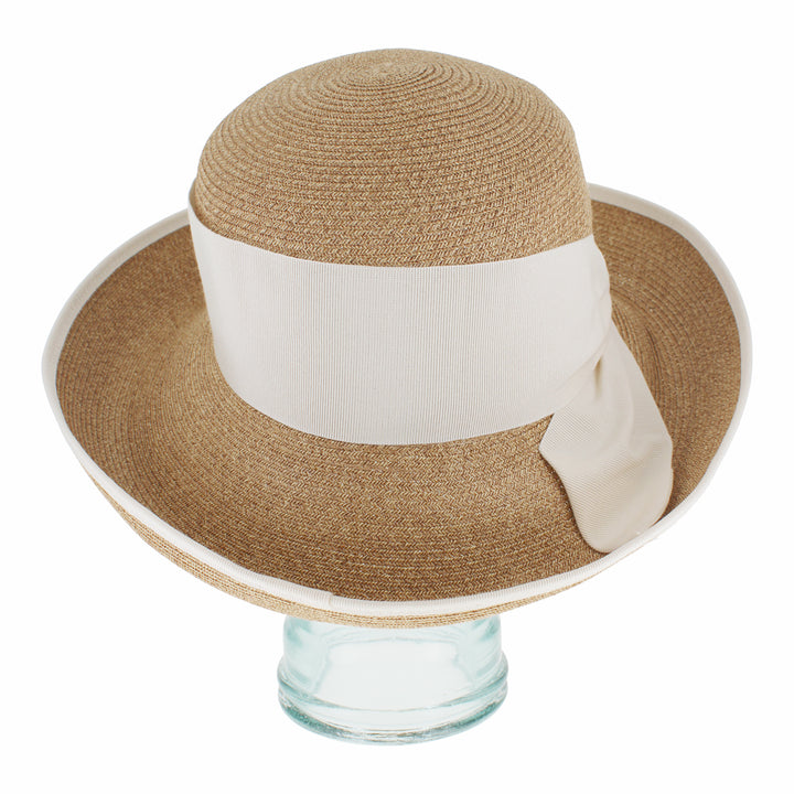 Lightweight natural cloche hat with packable design for travel and everyday wear