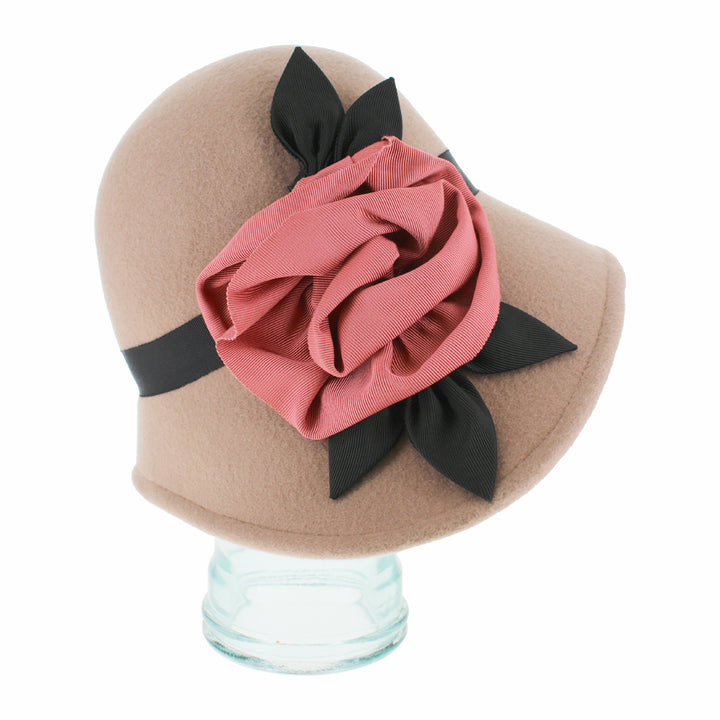 Close-up of the Belfry Woodhouse taupe wool cloche hat featuring grosgrain band with handcrafted flower detail, a chic autumn and winter piece blending vintage and modern style